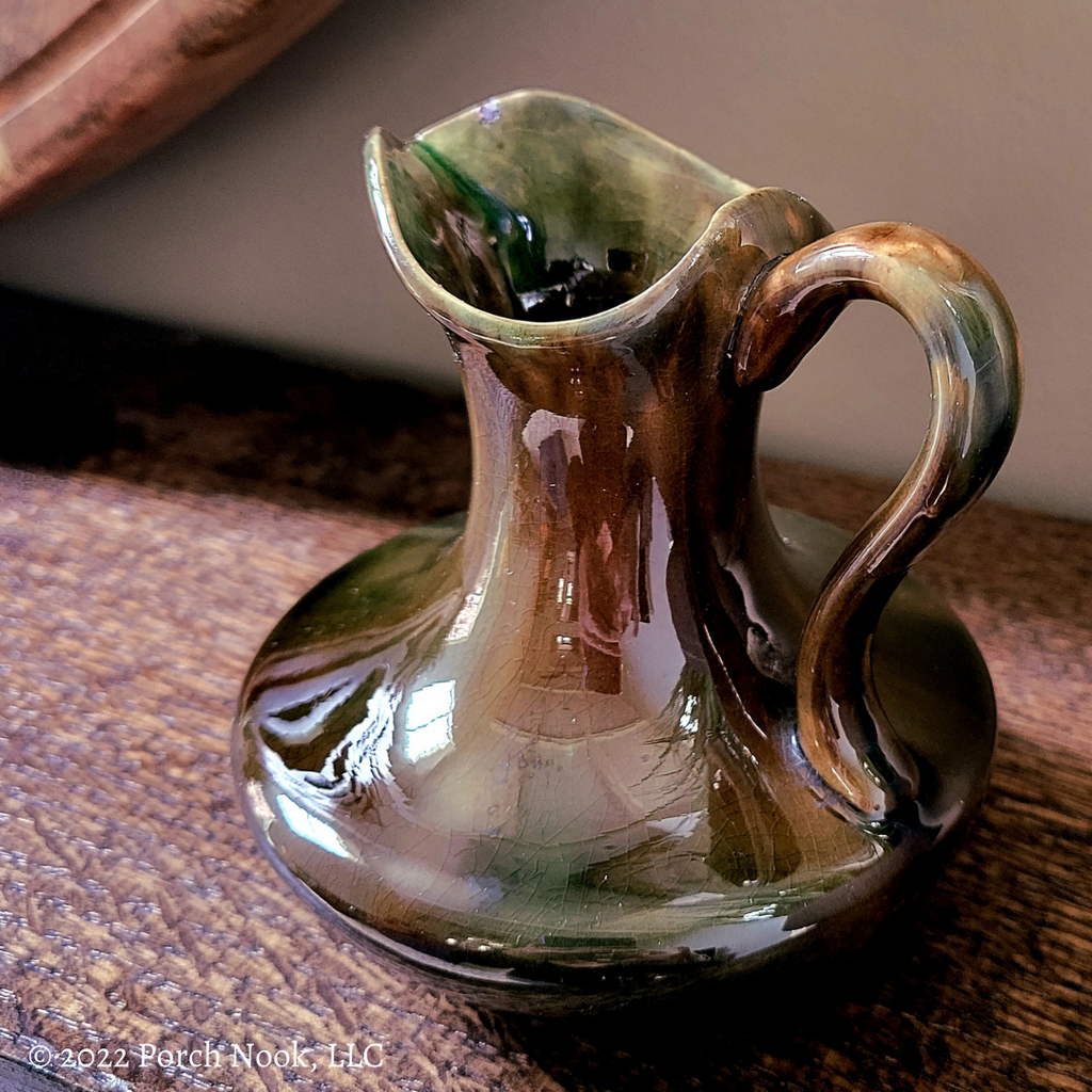 Stoneware pot on pinched foot, mottled brown glaze, Drinking jug cup  drinking utensils tableware holder soil find ceramic stoneware clay engobe  glaze salt glaze, hand-turned glazed baked stoneware pot jug on pinched