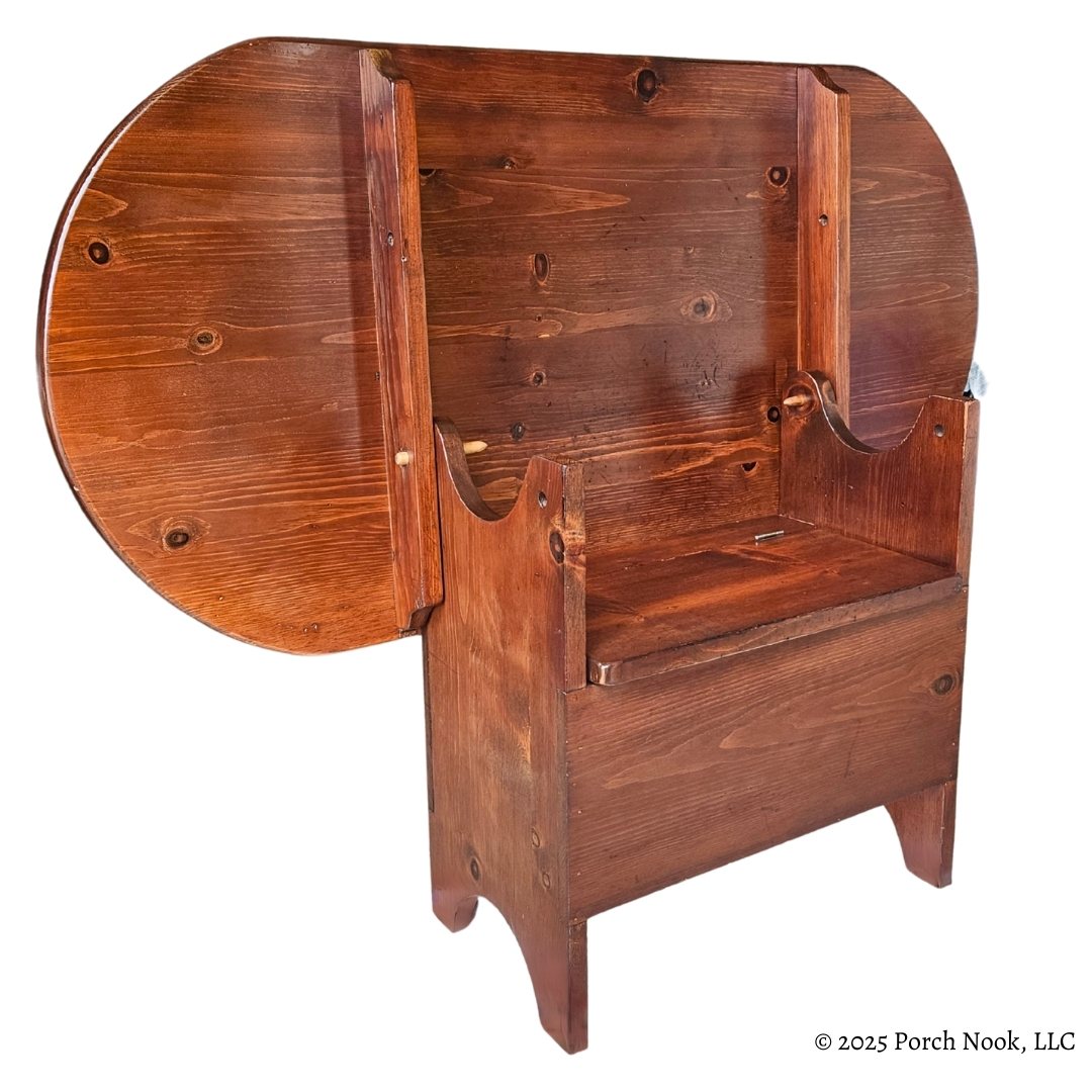 Vintage Pennsylvania Dutch Convertible Tilt-Top Table with Bench Seat and Storage Wooden bench with round seat and backrest on a white background