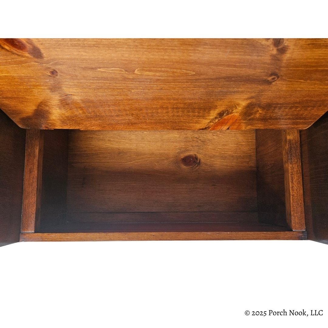 Vintage Pennsylvania Dutch Convertible Tilt-Top Table with Bench Seat and Storage - Close-up of a wooden bench with a white background