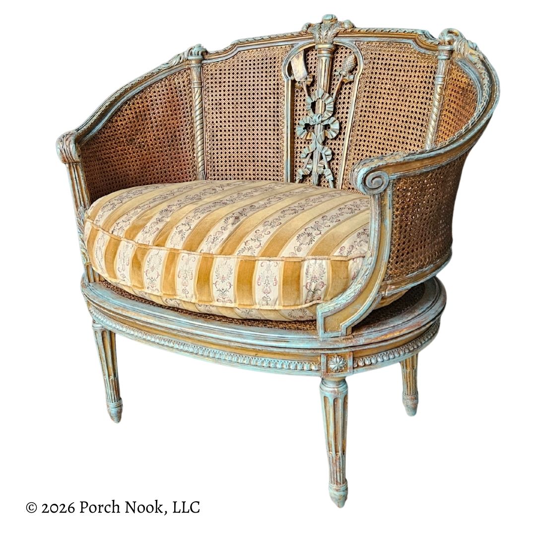 Decorative armchair with striped cushion on a white background