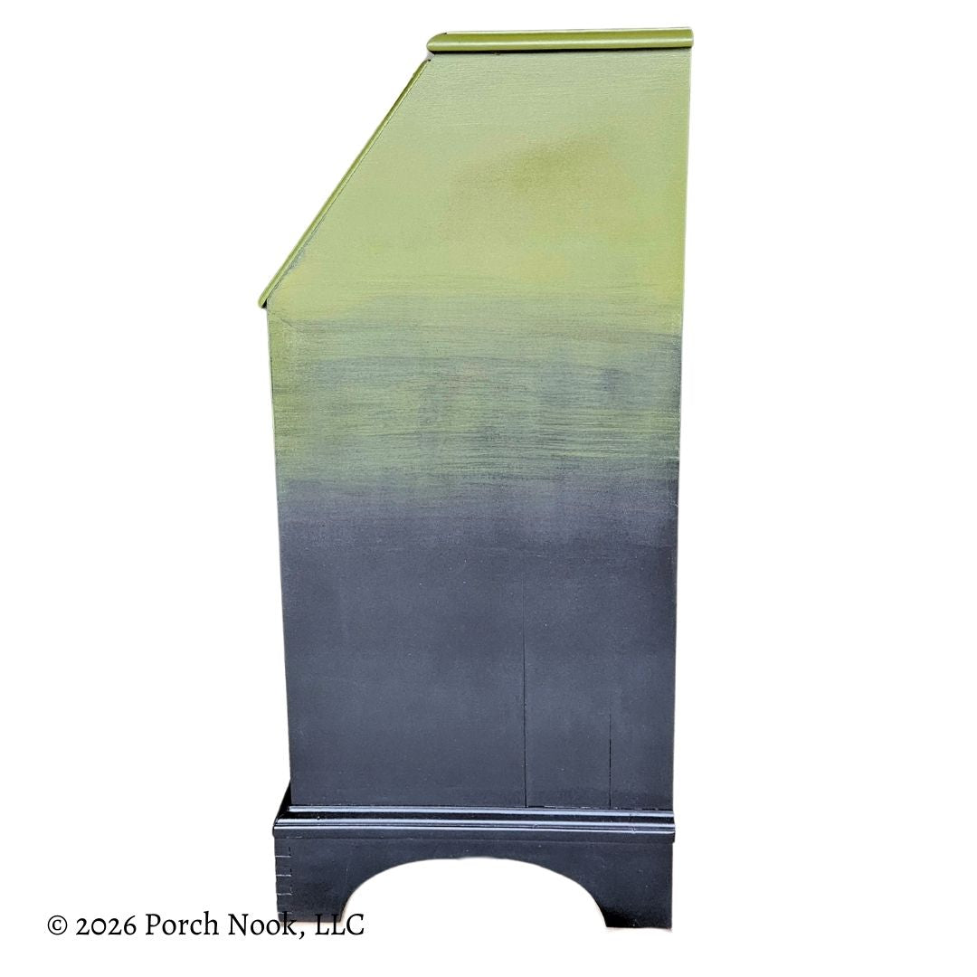 Opposite side view of painted vintage secretary desk highlighting smooth ombre transition from mossy green to black