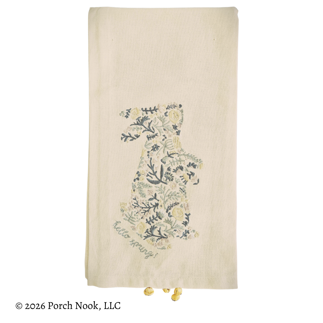 Embroidered floral bunny silhouette towel with 'hello world' text on a white background