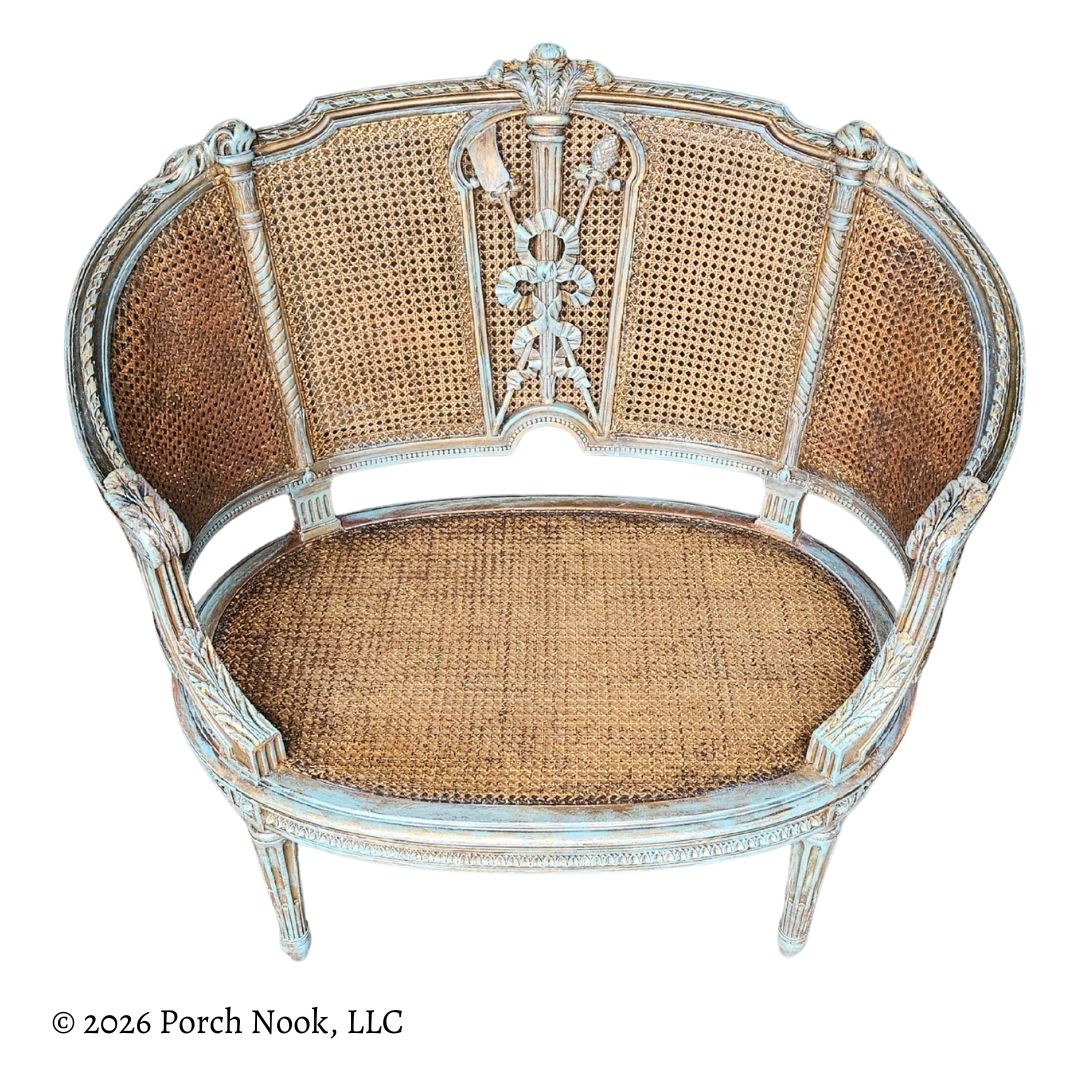 Decorative painted chair with wicker back and seat on a white background