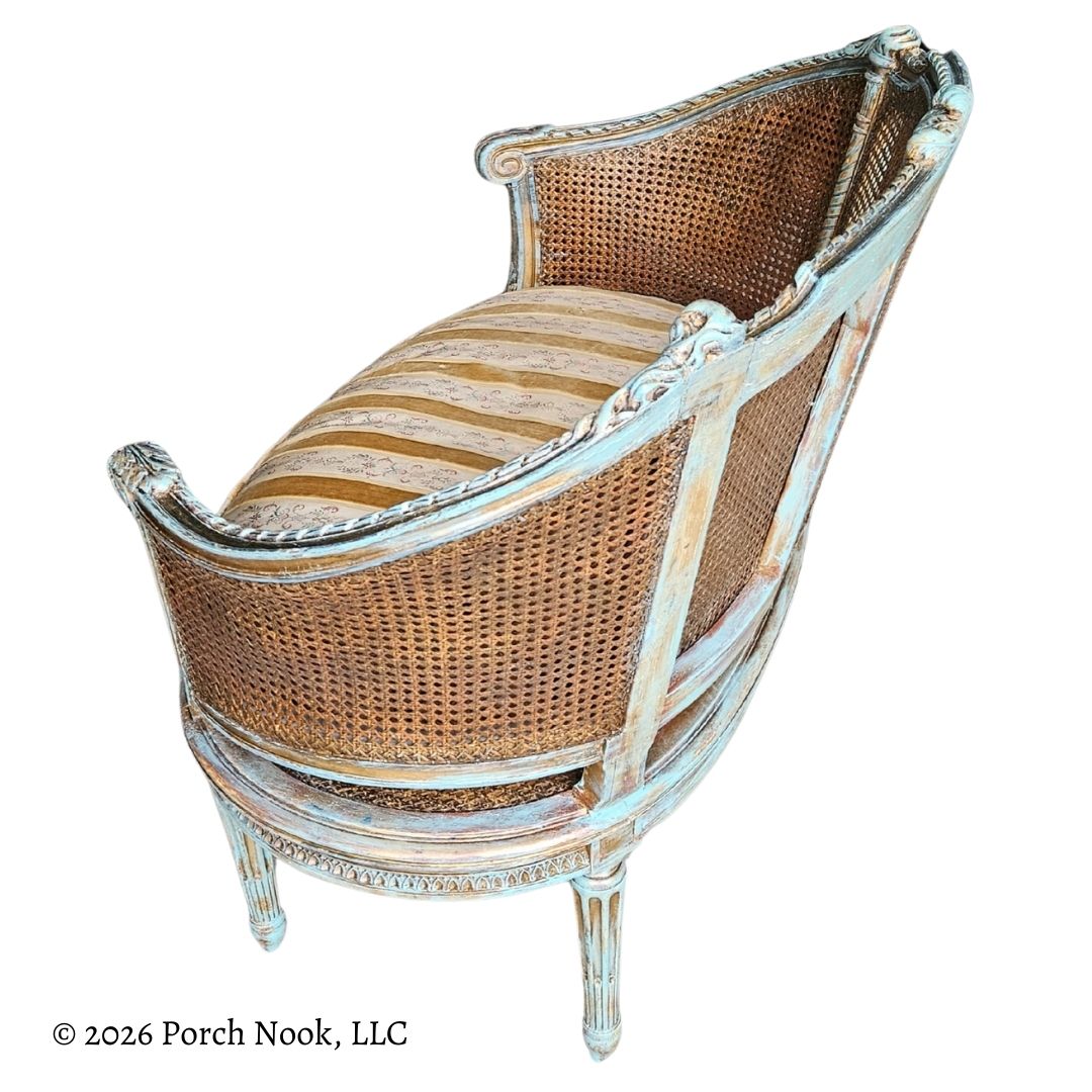 Wicker bench with decorative frame on a white background