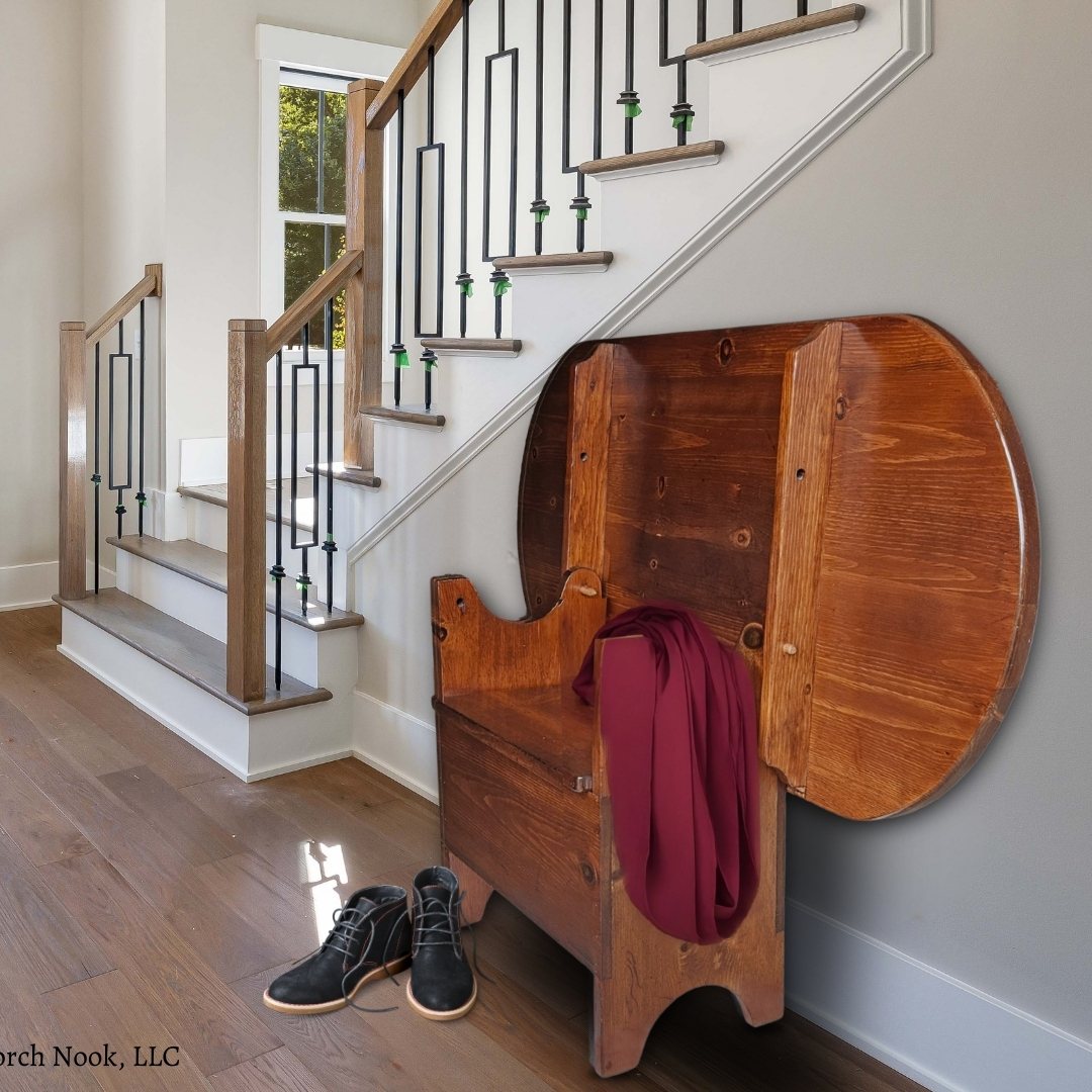 Vintage Pennsylvania Dutch Convertible Tilt-Top Table with Bench Seat and Storage - Wooden bench with a red blanket against a staircase in a home setting