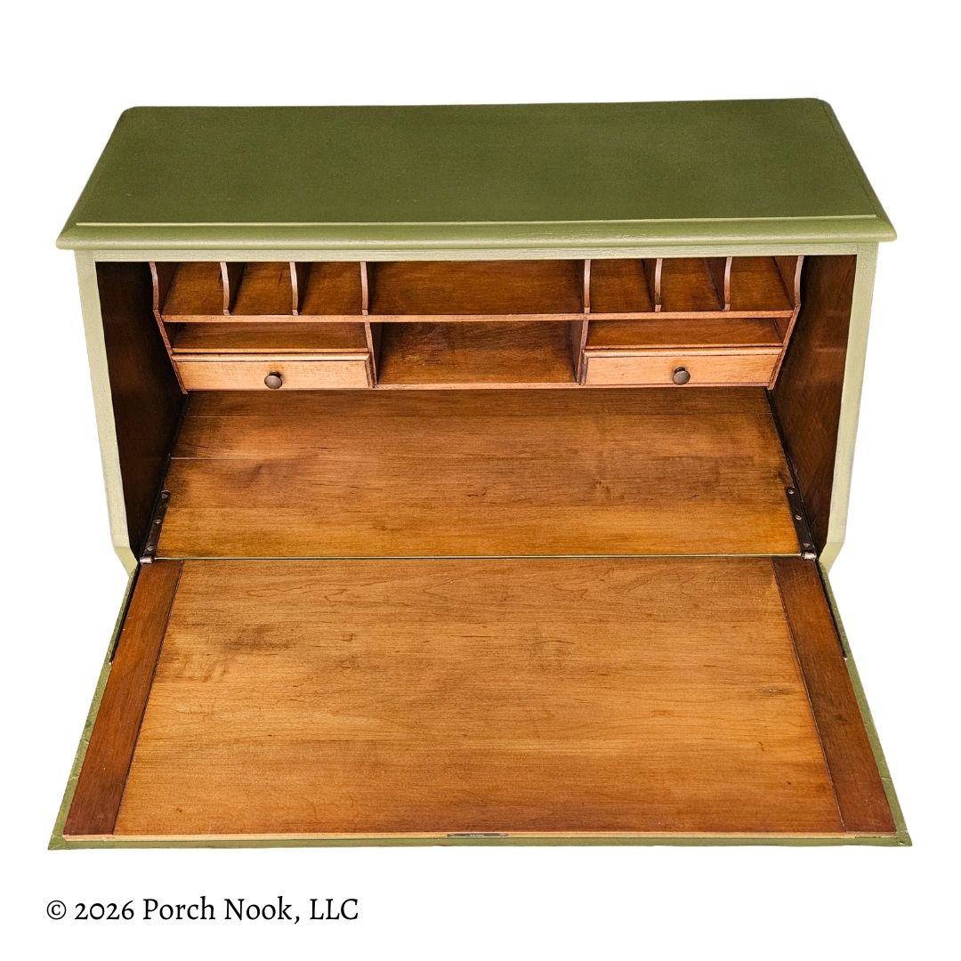 Front view of secretary desk interior featuring fold-down writing surface, natural wood finish, and built-in organizer compartments
